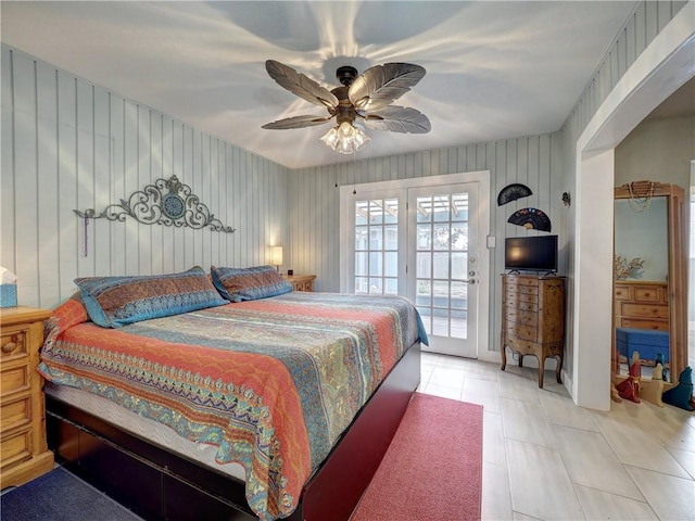 bedroom with light tile patterned flooring, access to exterior, and ceiling fan