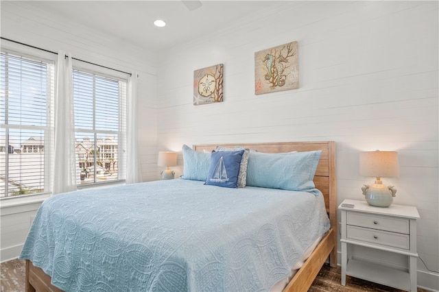 bedroom with dark wood-type flooring