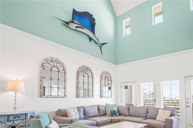 living room featuring a towering ceiling