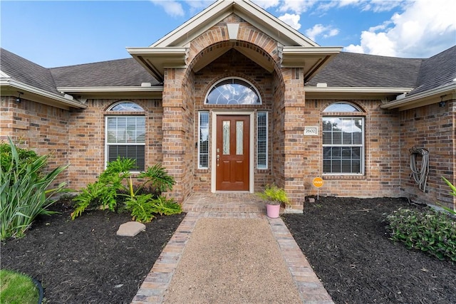 7602 Beau Terre, Corpus Christi, TX 78414 - view of exterior entry with brick siding and a shingled roof