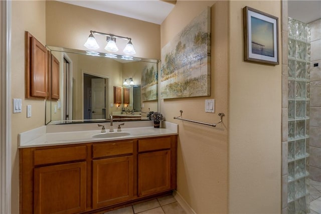 7602 Beau Terre, Corpus Christi, TX 78414 - bathroom with vanity, tile patterned flooring, and a walk in shower