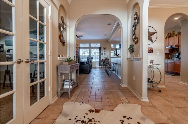 7602 Beau Terre, Corpus Christi, TX 78414 - entryway featuring ornamental molding, french doors, arched walkways, light tile patterned floors, and ceiling fan