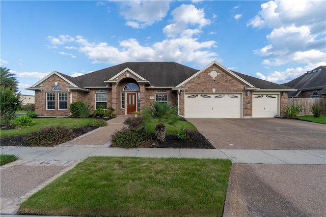 7602 Beau Terre, Corpus Christi, TX 78414 - single story home featuring a garage, concrete driveway, and brick siding