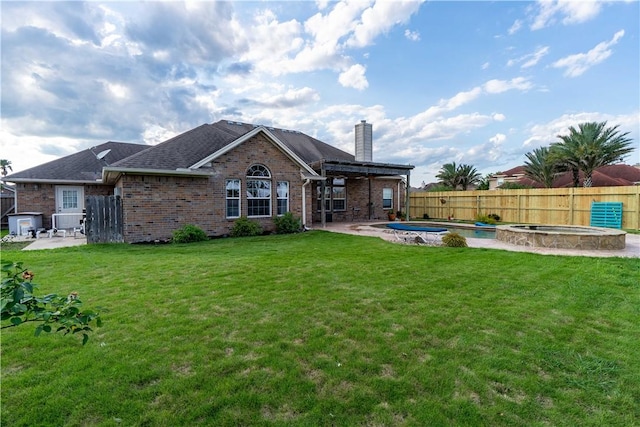 7602 Beau Terre, Corpus Christi, TX 78414 - rear view of house featuring a fenced backyard, a chimney, brick siding, and a patio area