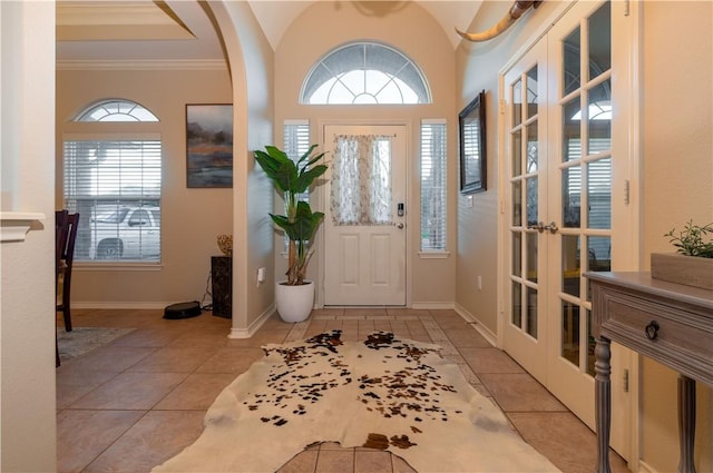7602 Beau Terre, Corpus Christi, TX 78414 - entrance foyer with french doors, light tile patterned floors, and ornamental molding