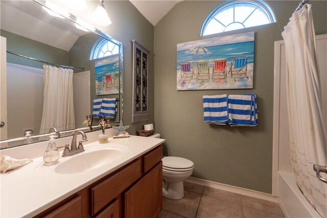 7602 Beau Terre, Corpus Christi, TX 78414 - full bathroom with vaulted ceiling, vanity, tile patterned floors, shower / bathtub combination with curtain, and healthy amount of natural light