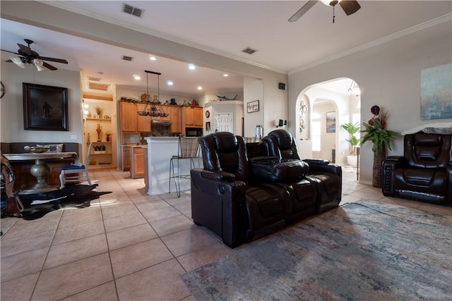 7602 Beau Terre, Corpus Christi, TX 78414 - living area featuring a ceiling fan, light tile patterned floors, arched walkways, ornamental molding, and recessed lighting
