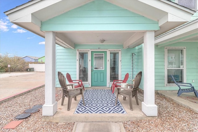 property entrance with a patio area