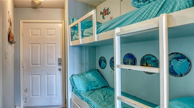 3938 Surfside Blvd Unit 3336, Corpus Christi, TX 78402 - bedroom featuring a textured ceiling