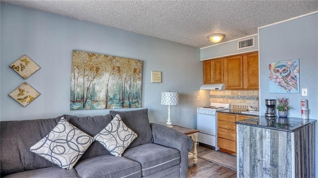3938 Surfside Blvd Unit 3336, Corpus Christi, TX 78402 - living area with dark wood-style flooring and a textured ceiling