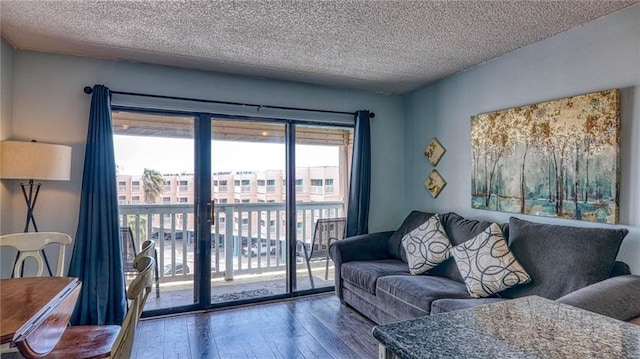 3938 Surfside Blvd Unit 3336, Corpus Christi, TX 78402 - living room with wood finished floors and a textured ceiling