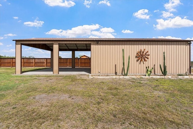 view of yard featuring fence and a patio