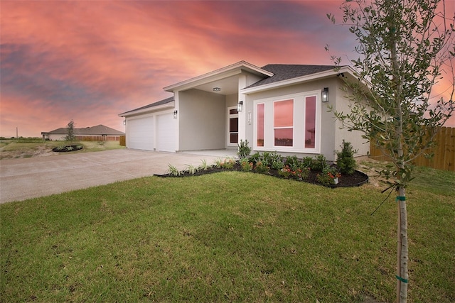 714 Papa Mori Dr, Corpus Christi, TX 78415 - view of front facade featuring stucco siding, concrete driveway, an attached garage, and roof with shingles