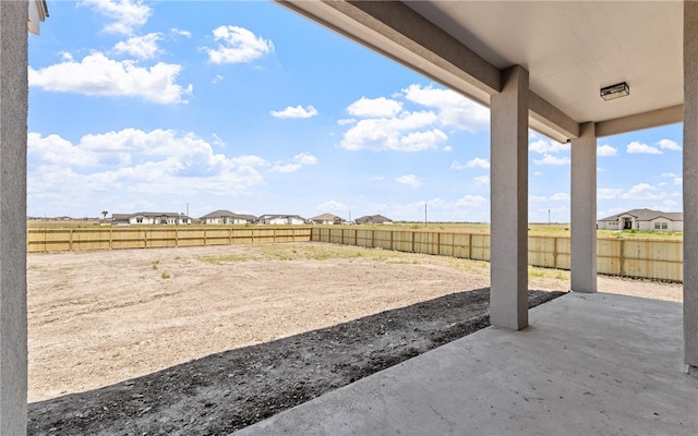 714 Papa Mori Dr, Corpus Christi, TX 78415 - fenced backyard with a patio and a residential view