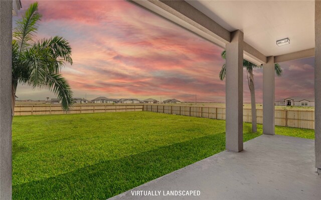 714 Papa Mori Dr, Corpus Christi, TX 78415 - yard at dusk featuring a patio area
