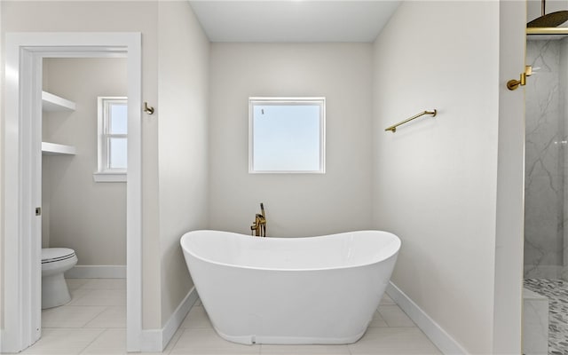 714 Papa Mori Dr, Corpus Christi, TX 78415 - full bath featuring toilet, a marble finish shower, a soaking tub, and baseboards