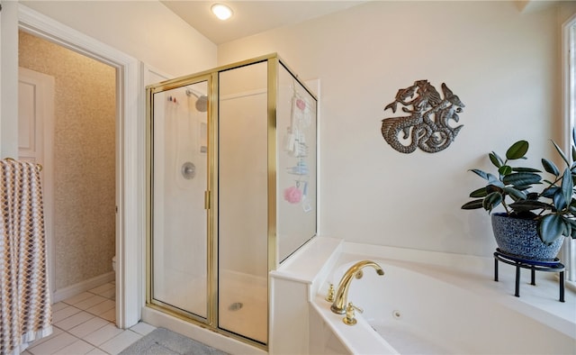 bathroom with separate shower and tub and tile patterned floors