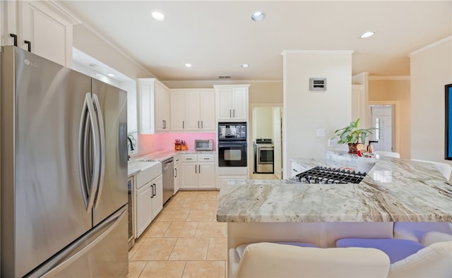 kitchen featuring a kitchen bar, light stone counters, black appliances, kitchen peninsula, and white cabinets