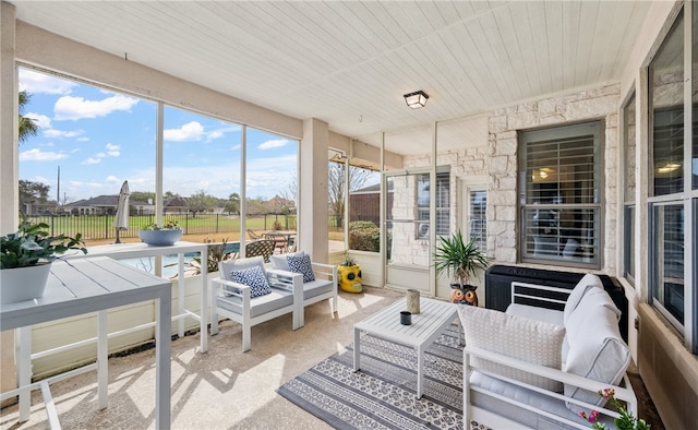 sunroom featuring wood ceiling