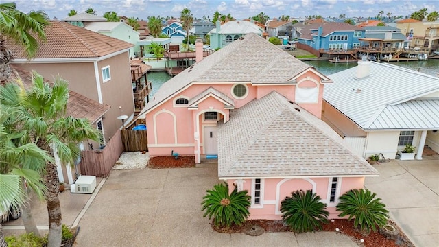 aerial view featuring a residential view and a water view