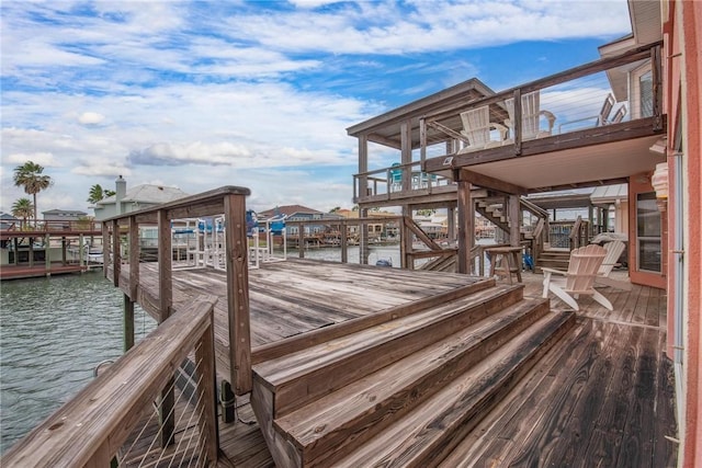 view of dock with stairway and a water view