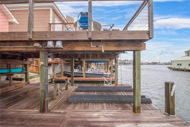 view of dock with a water view and boat lift
