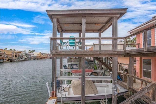 view of dock featuring a water view and boat lift