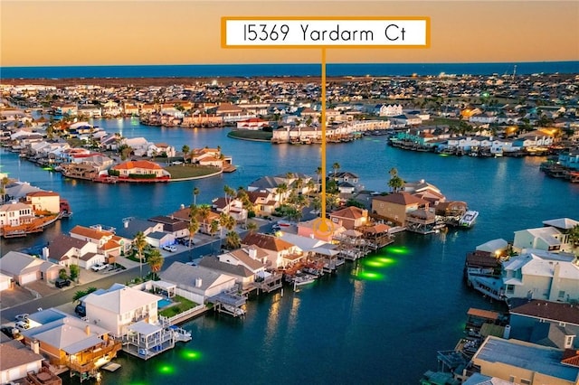 aerial view with a residential view and a water view