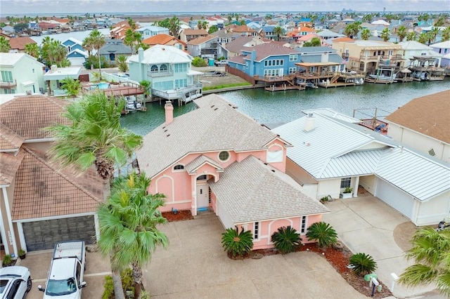 aerial view with a water view and a residential view