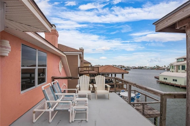 view of patio with a water view