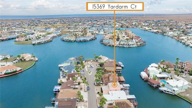 birds eye view of property featuring a residential view and a water view