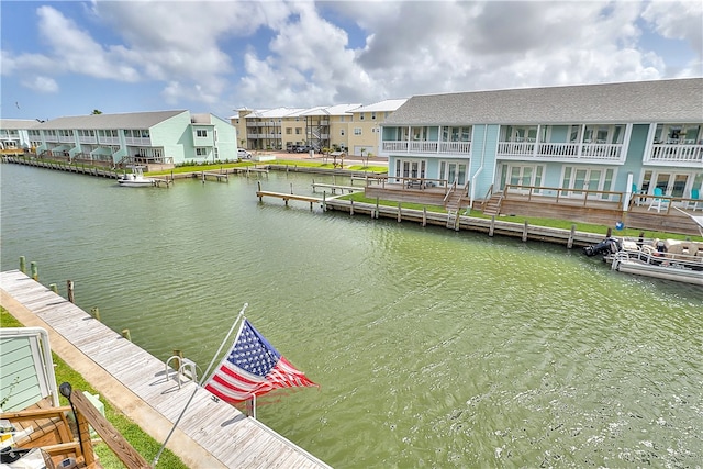 view of dock with a water view and a balcony