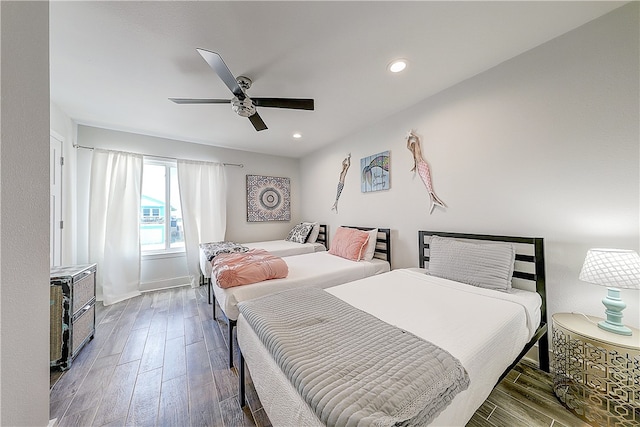 bedroom featuring hardwood / wood-style floors and ceiling fan