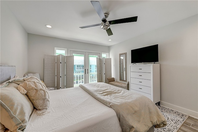 bedroom with access to outside, hardwood / wood-style floors, and ceiling fan