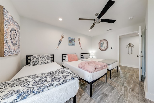 bedroom featuring hardwood / wood-style floors and ceiling fan