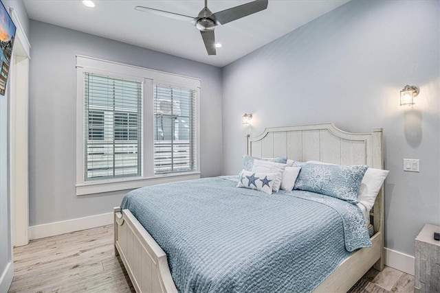 bedroom with recessed lighting, light wood-type flooring, a ceiling fan, and baseboards