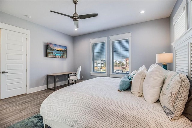 bedroom featuring recessed lighting, wood finished floors, a ceiling fan, and baseboards