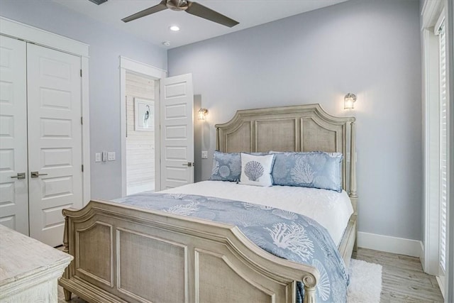 bedroom featuring baseboards, light wood-style flooring, ceiling fan, a closet, and recessed lighting