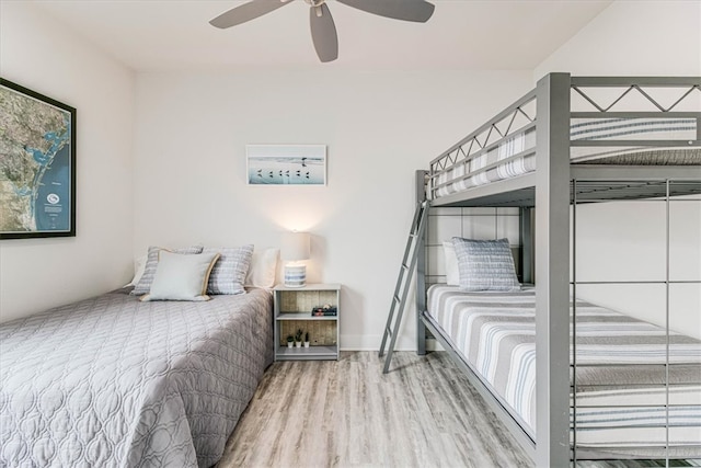 bedroom with a ceiling fan and wood finished floors