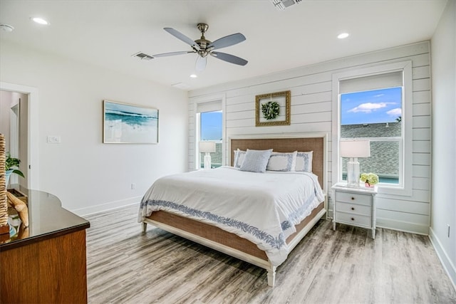 bedroom with recessed lighting, baseboards, light wood-type flooring, and ceiling fan