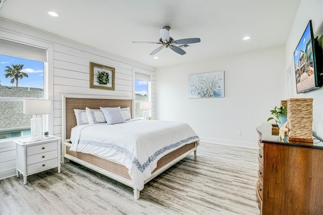 bedroom with recessed lighting, baseboards, and light wood-style flooring