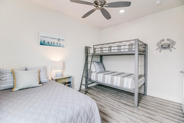 bedroom with ceiling fan, baseboards, wood finished floors, and recessed lighting