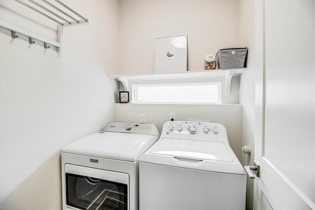 washroom with washer and dryer and laundry area