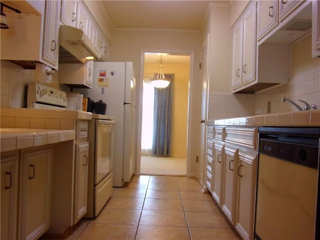 kitchen featuring tasteful backsplash, tile counters, dishwasher, under cabinet range hood, and light tile patterned flooring