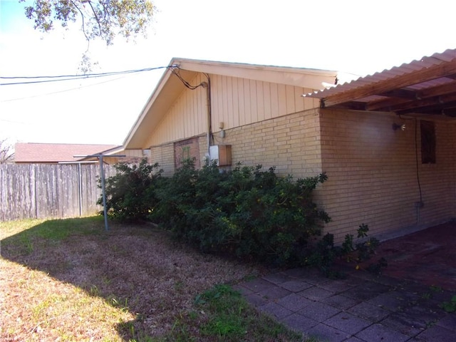 view of home's exterior featuring brick siding