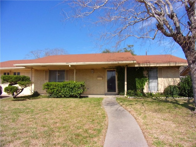 4634 Bonner Dr, Corpus Christi, TX 78411 - single story home featuring a front lawn and brick siding