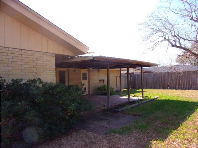 view of yard with fence and a patio