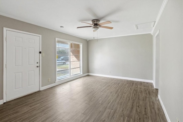 entryway featuring dark hardwood / wood-style flooring, ceiling fan, and crown molding