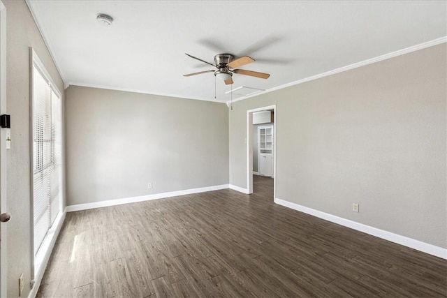 spare room with crown molding, ceiling fan, and dark hardwood / wood-style floors