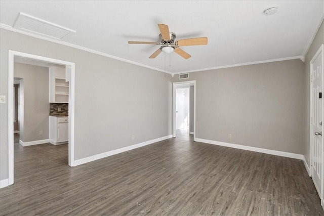 empty room featuring crown molding, ceiling fan, and dark hardwood / wood-style floors